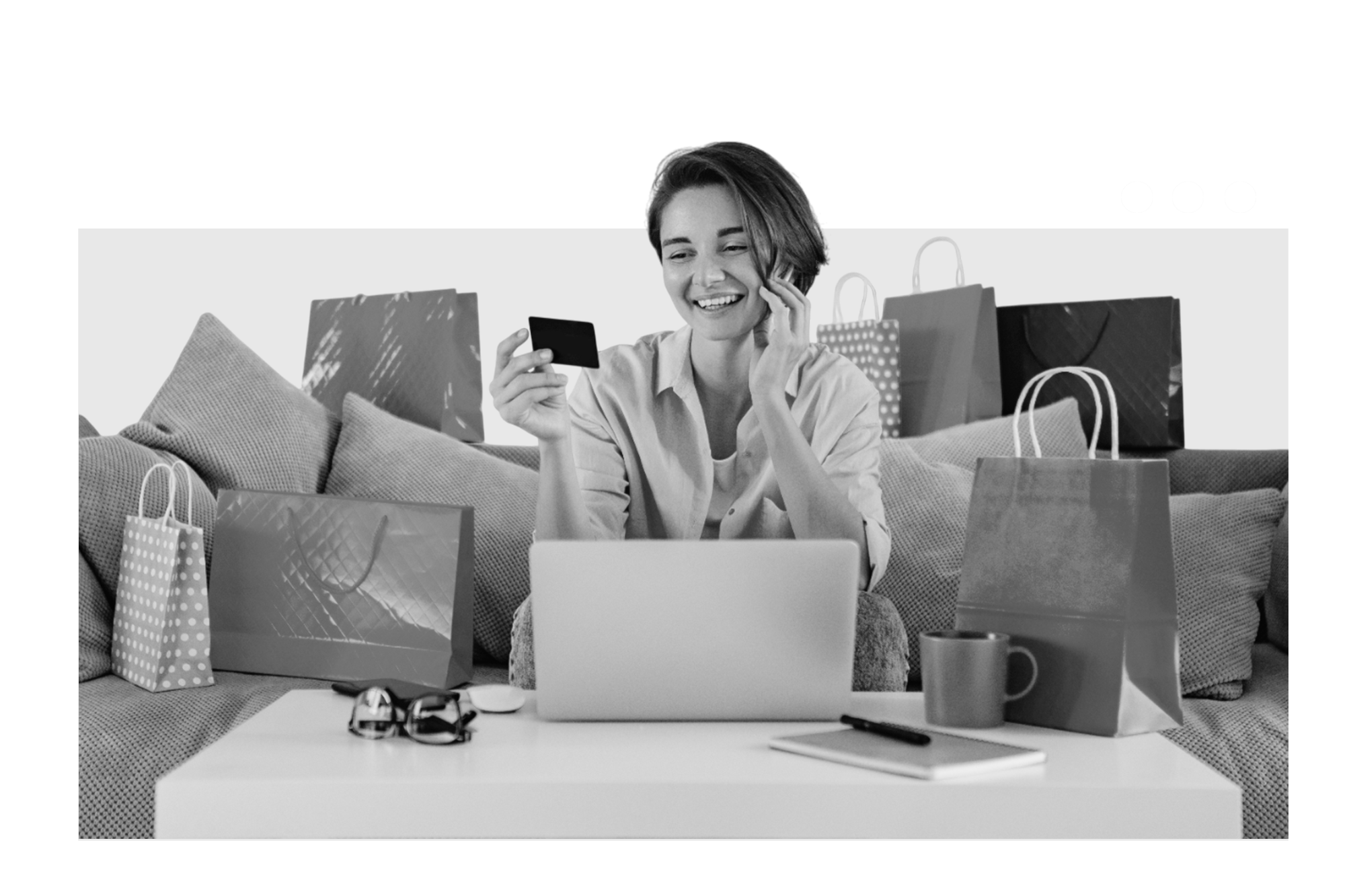 cheerful-woman-laughing-while-working-with-laptop-listening-music-earphones